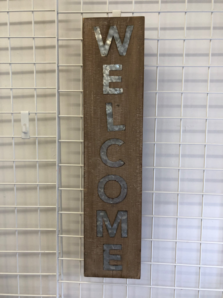 METAL "WELCOME" ON WOOD WALL/STANDING.