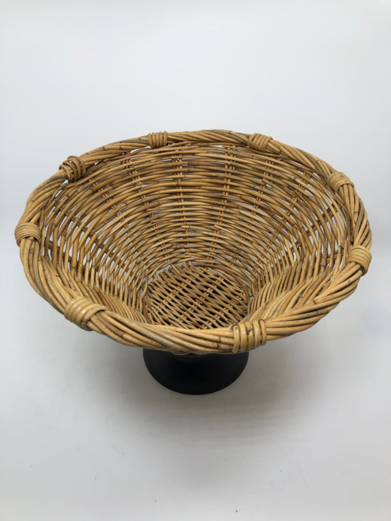 WOVEN BASKET ON BLACK METAL PEDESTAL.