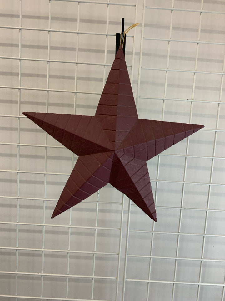 RED TIN STAR WALL HANGING.