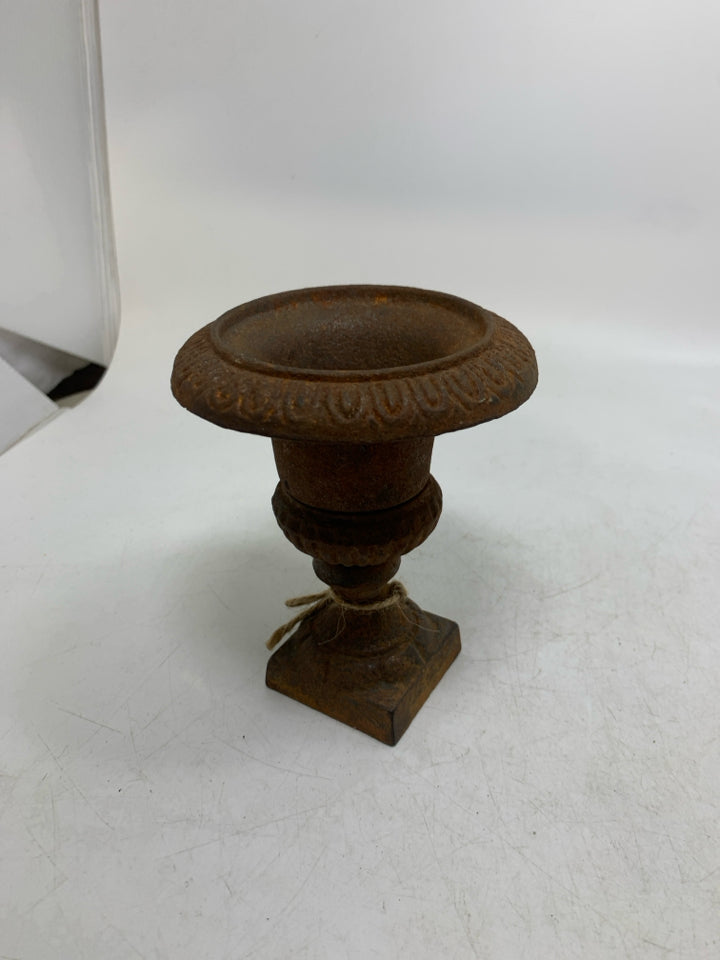 RUSTED HEAVY METAL FOOTED VASE.