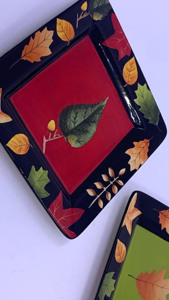 2 BLACK SQUARE LEAF PAINTED PLATES.