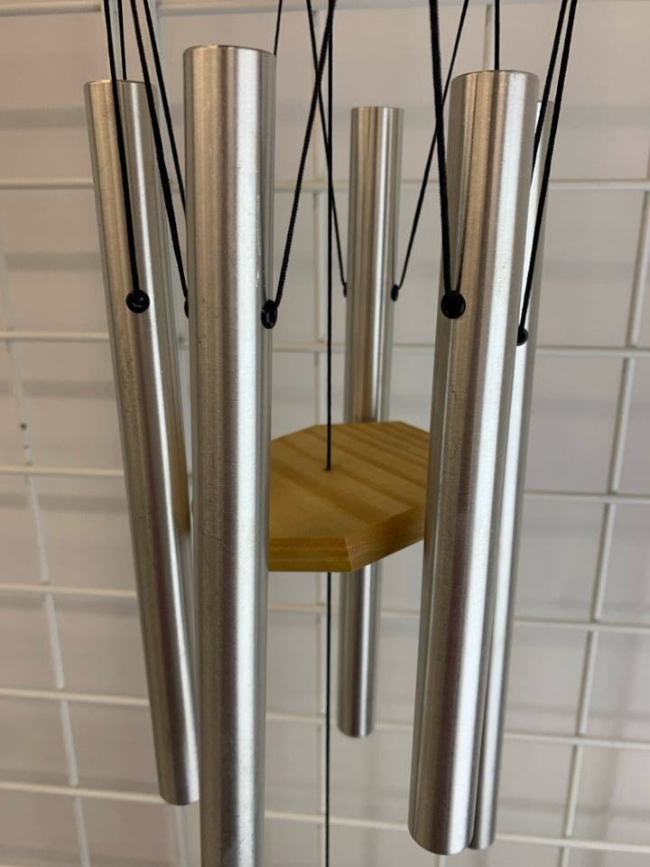WOODEN WIND CHIME W/SILVER CHIMES.