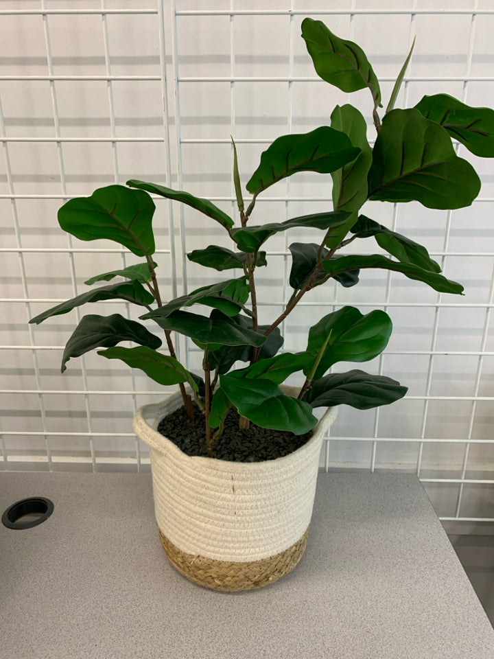 FAUX PLANT IN WOVEN POT.
