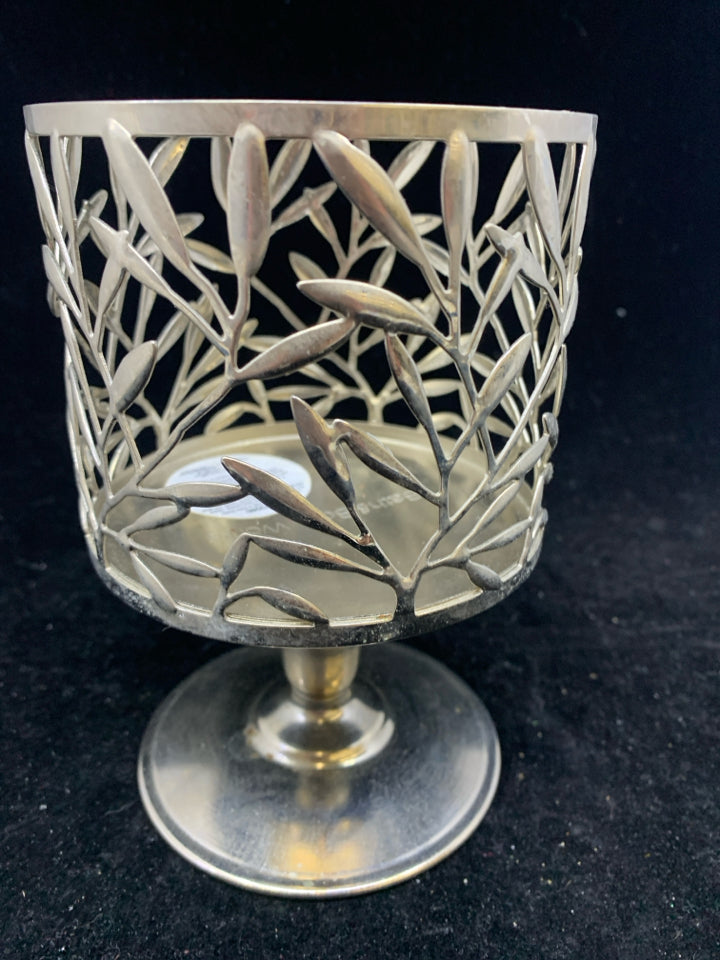 FOOTED SILVER METAL CANDLE SLEEVE LEAF DETAIL.