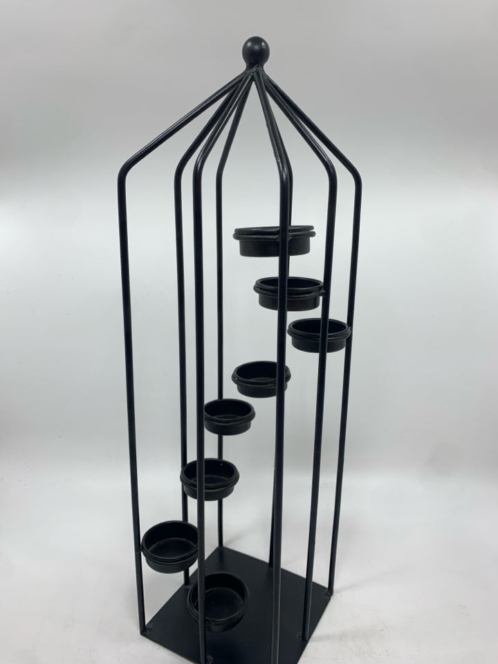 STAIRWAY OF LIGHT VOTIVE TOWER.
