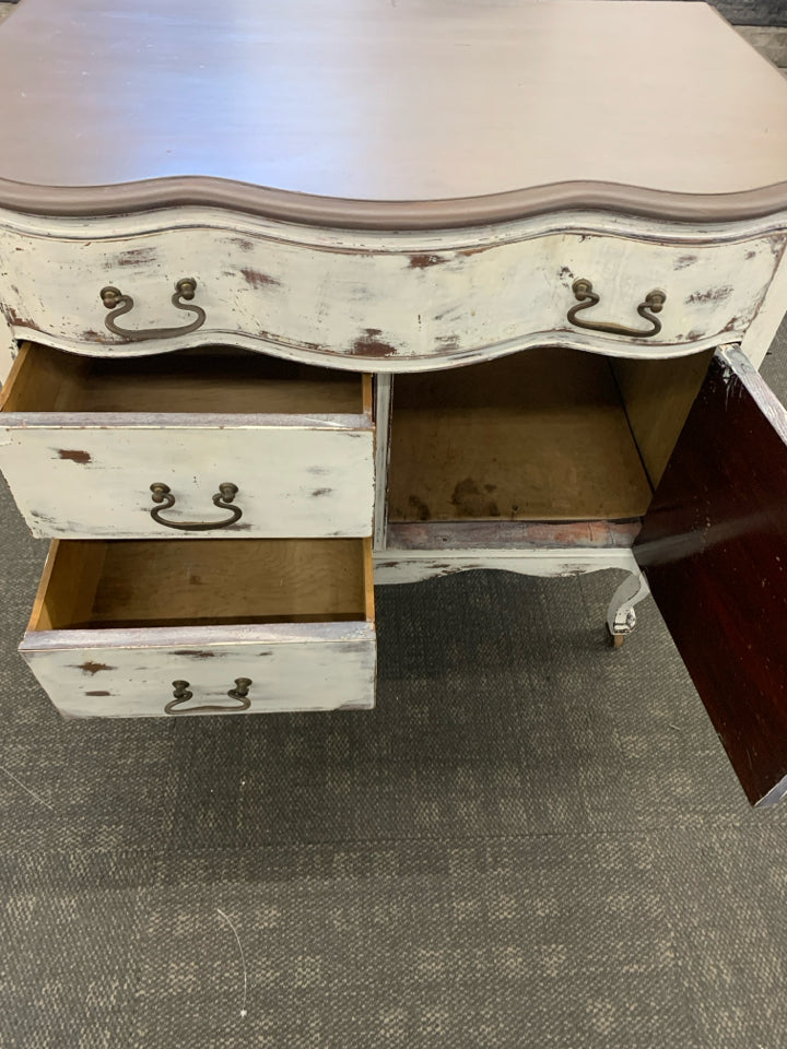 DISTRESSED DRESSER ON WHEELS.