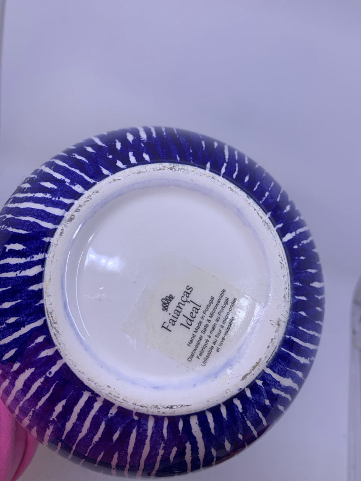 WHITE CERAMIC VASE W/ BLUE STRIPES.