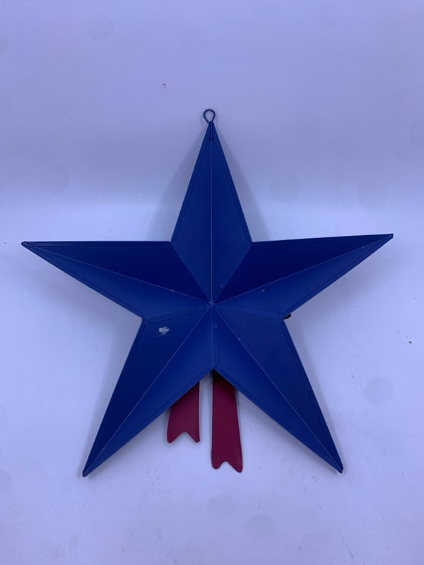 BLUE AND WHITE METAL STAR W/ RED BOW WALL HANGING.