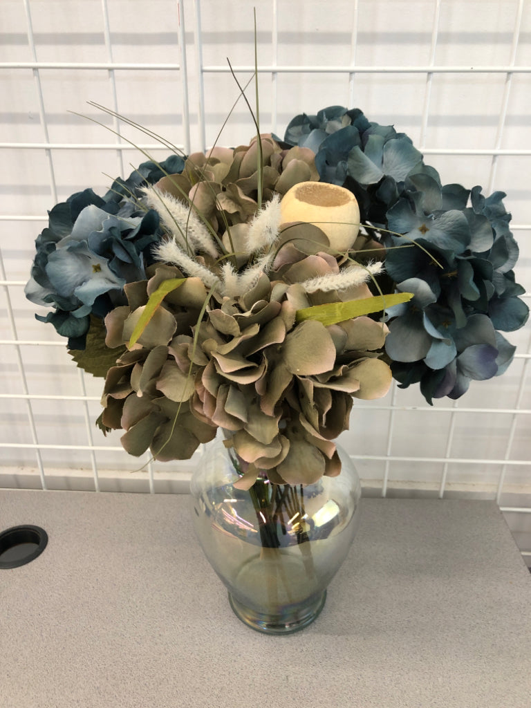 BLUE HYDRANGEA BOUQUET IN IRIDESCENT VASE.