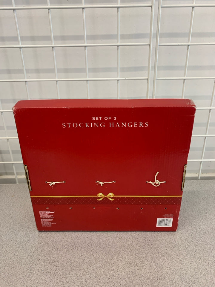 NIP 3 PC SNOWMAN STOCKING HANGERS.