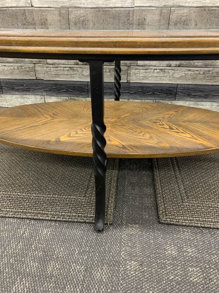 OVAL WOOD W GLASS TOP AND BOTTOM STORAGE COFFEE TABLE.