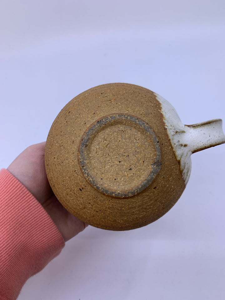 MATTE TAN CREAMER W/ WHITE SPECKLED SIDE/INSIDE POTTERY.