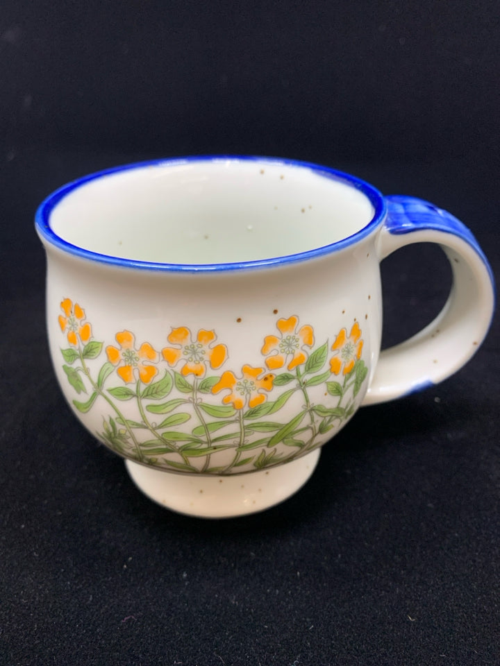 BLUE CERAMIC DOTTED MUG W/ORANGE FLOWERS.