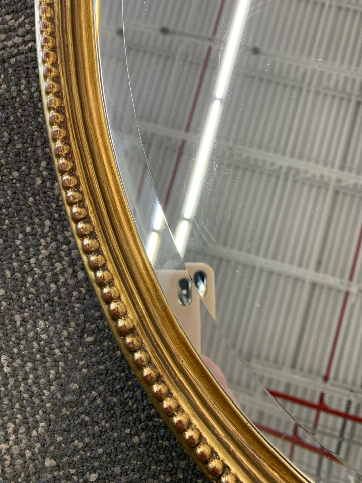 LARGE GOLD PAINTED MIRROR W/ BEADED EDGE W/ CUTOUT ON TOP.