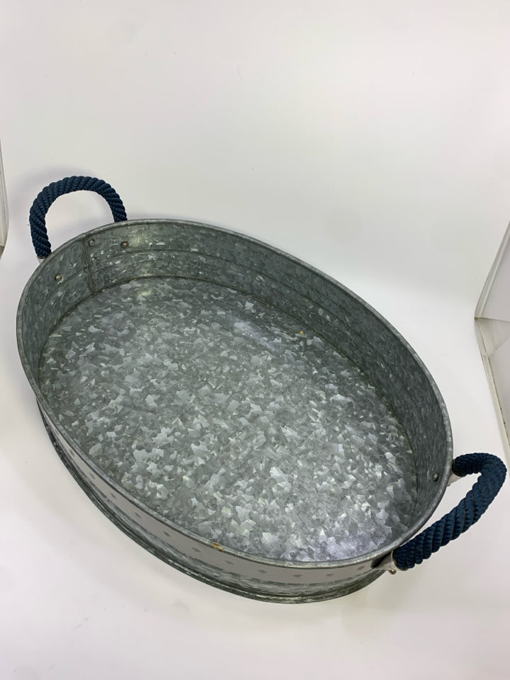 OVAL GALVANIZED METAL TRAY W/BLUE BRAID HANDLES.