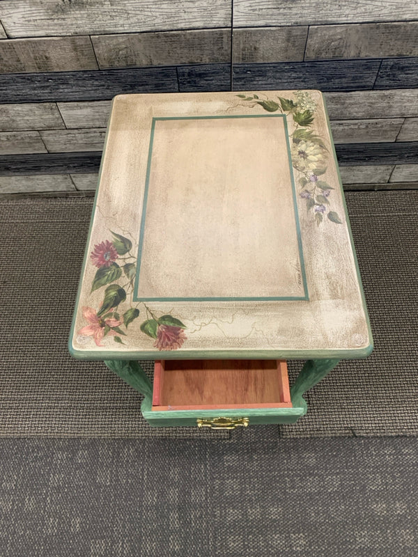 GREEN SIDE TABLE W/ PAINTED FLOWERS ON TOP W/ DRAWER.