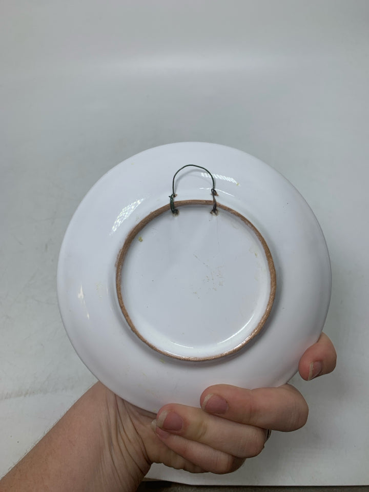 SMALL CERAMIC PLATE W/ DETAILED SUN IN CENTER.