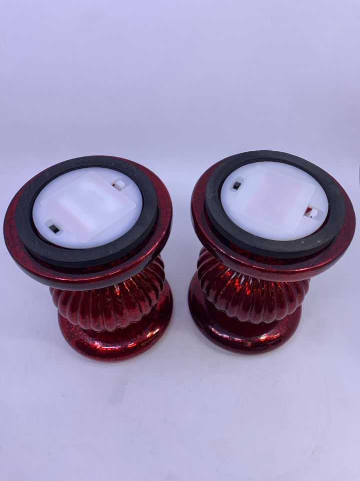 2 LIGHT UP RED GLASS MERCURY PILLAR CANDLES.