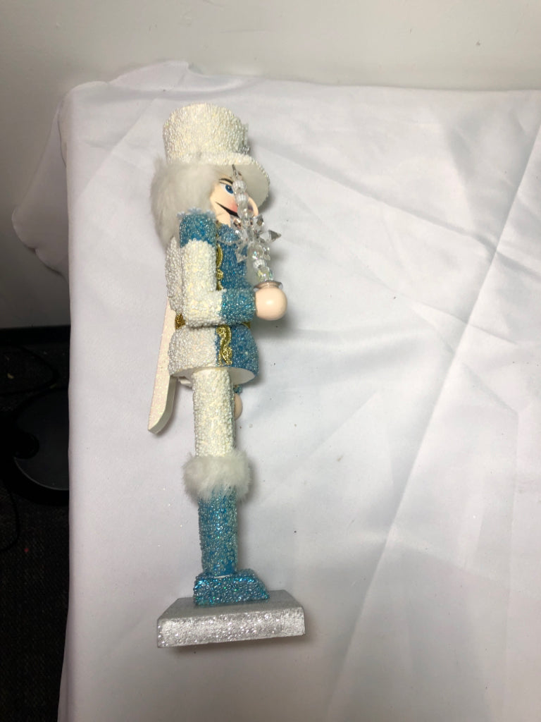 LIGHT BLUE AND WHITE SNOWFLAKE NUT CRACKER.