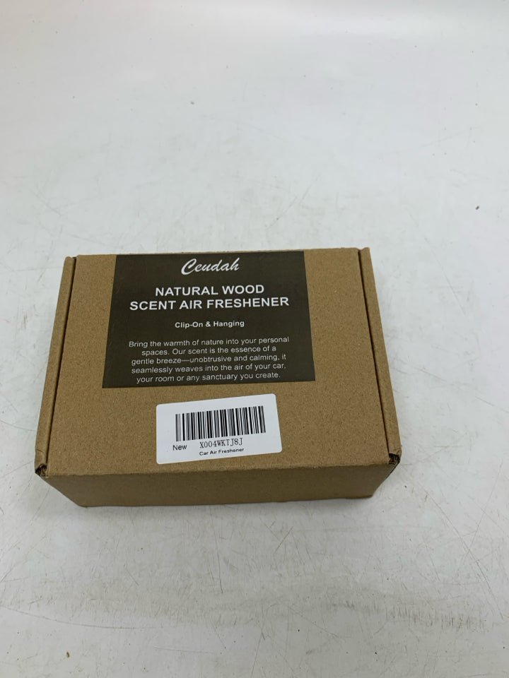NIB NATURAL WOOD SCENT AIR FRESHENER.