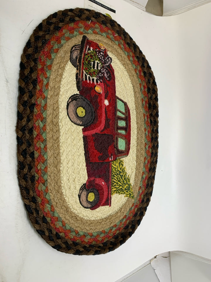 NWT SMALL OVAL BRAIDED RUG W/ PAINTED RED TRUCK EARTH RUNGS.