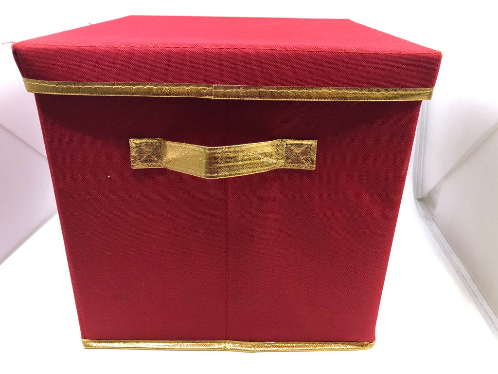RED STORAGE BOX W GOLD TRIM, LID, AND HANDLES.