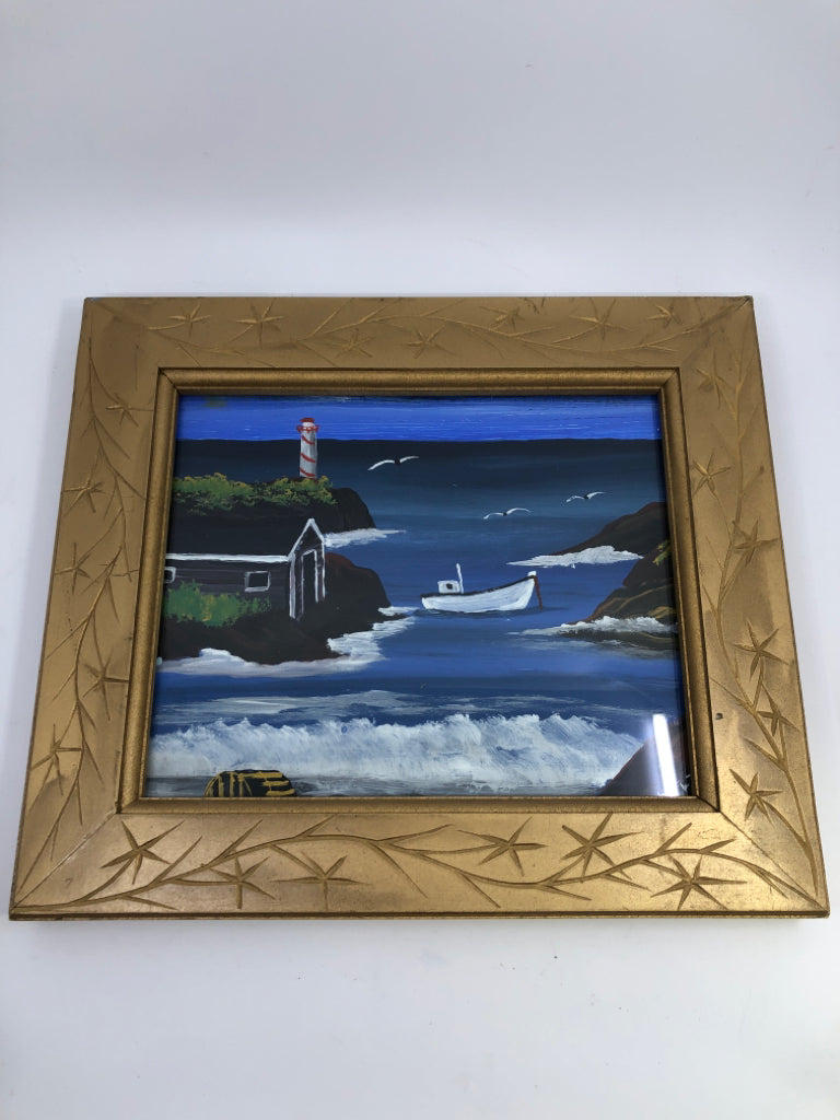 VERY HEAVY GOLD FRAME W/ PAINTED OCEAN THEME.