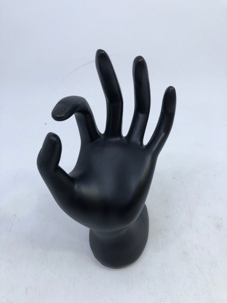 BLACK RESIN HAND RING HOLDER.