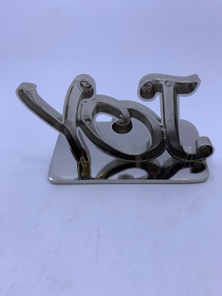 SILVER "JOY" STOCKING HOLDER.