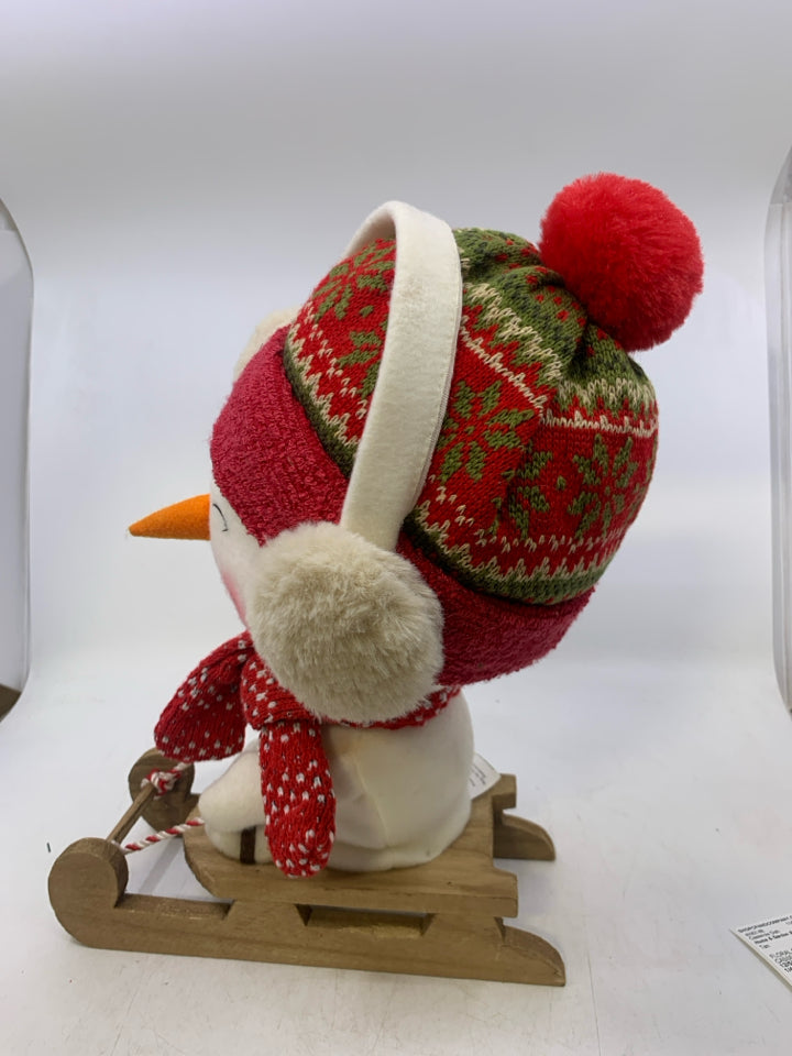 LARGE PLUSH SNOWMAN ON SLED.