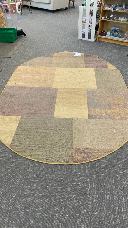 OVAL BROWN SQUARE PATTERN AREA RUG.