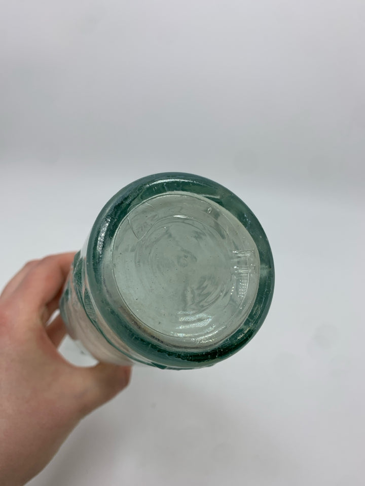 FLOWERS EMBOSSED CLEAR GLASS BOTTLE.