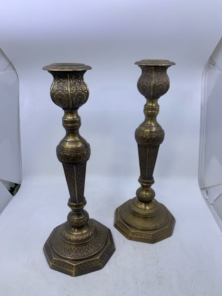 2 HEAVY ORNATE DETAILED METAL TAPERED CANDLE HOLDERS.