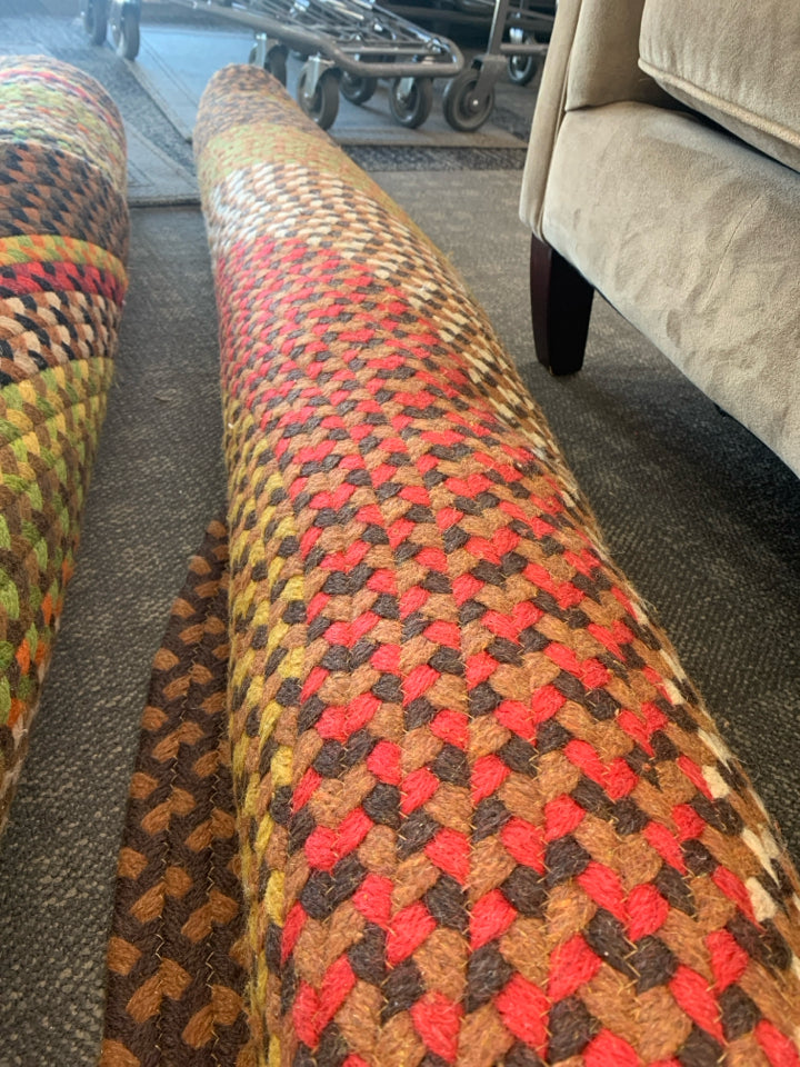 BROWN MULTI OVAL BRAIDED RUG.