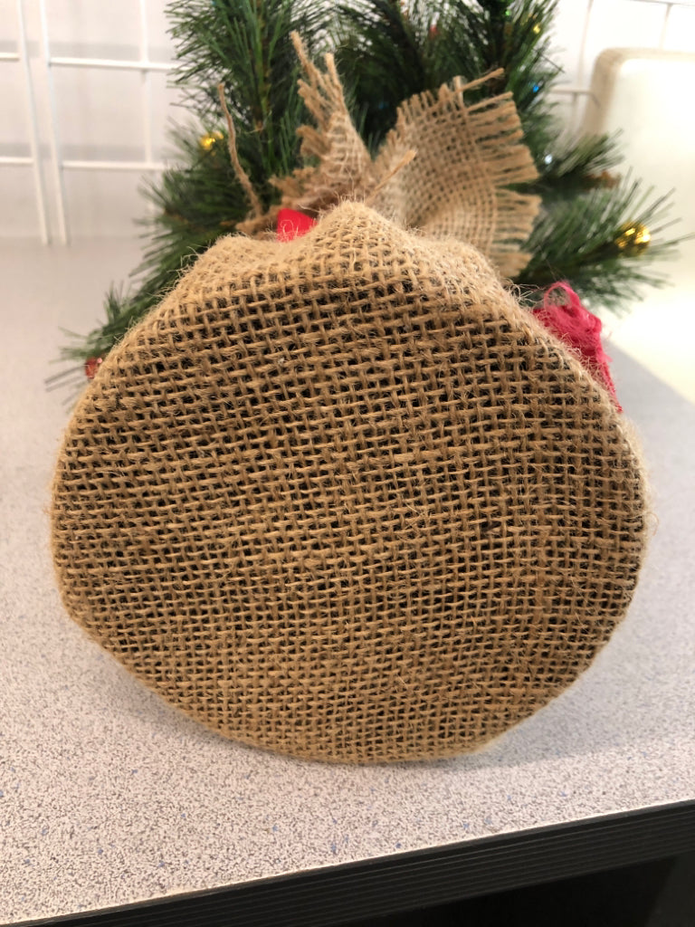 FAUX TREE W/COLORFUL ORNAMENTS IN BURLAP BASE.