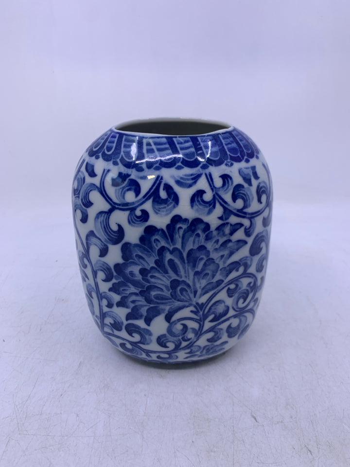 WHITE W/ BLUE FLORAL OVAL CERAMIC VASE.