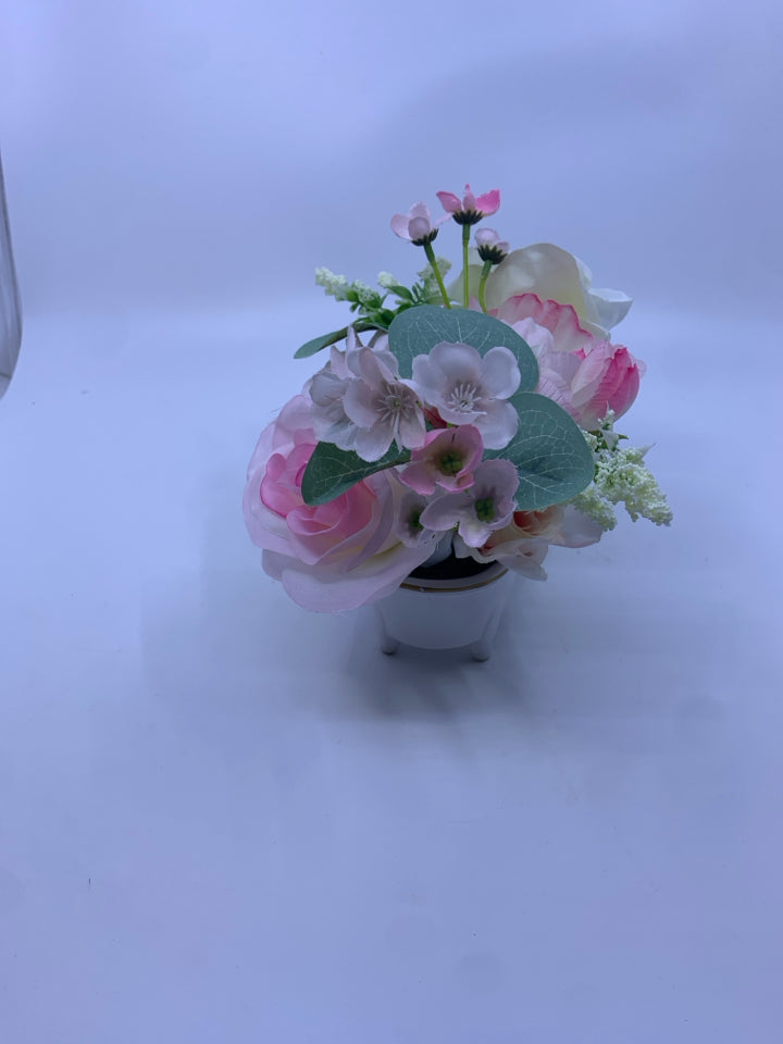FAUX BOUQUET PINK FLOWERS IN WHITE CERAMIC PLANTER SHAPED BATH TUB.