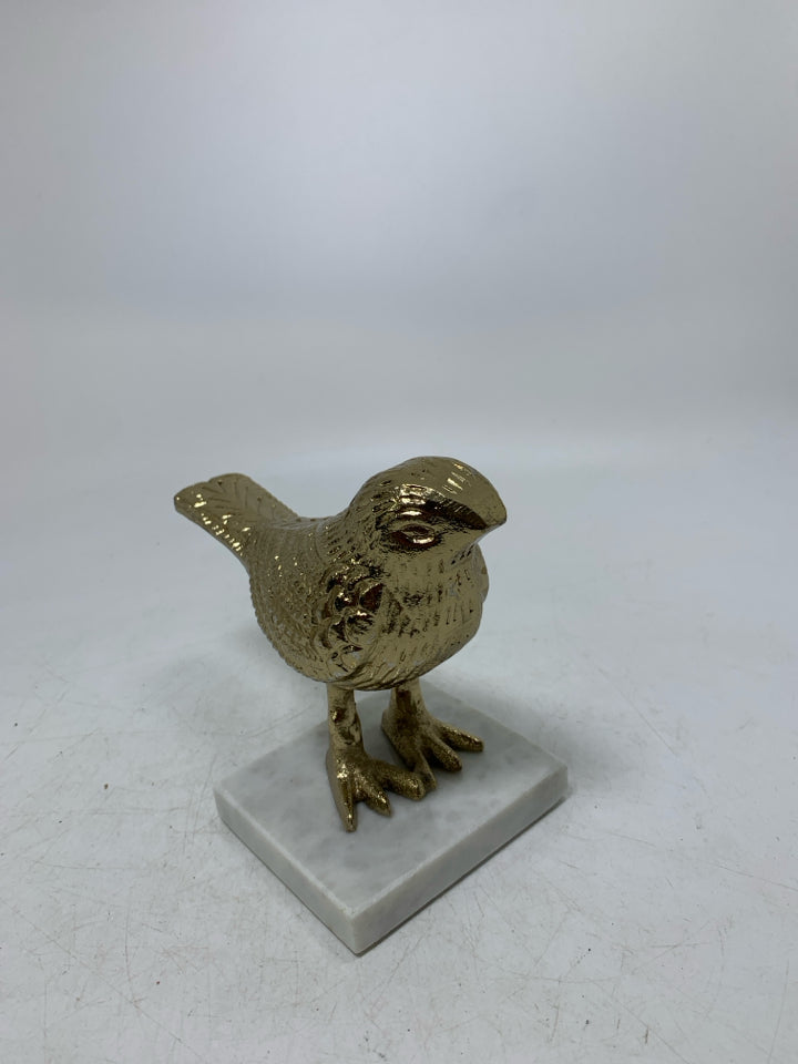 MARBLE SLAB W/ GOLD METAL BIRD DECOR.