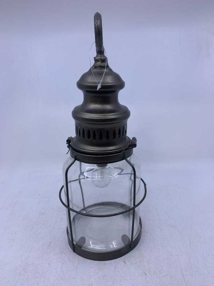 GREY METAL W/ GLASS BATTERY POWERED LANTERN.