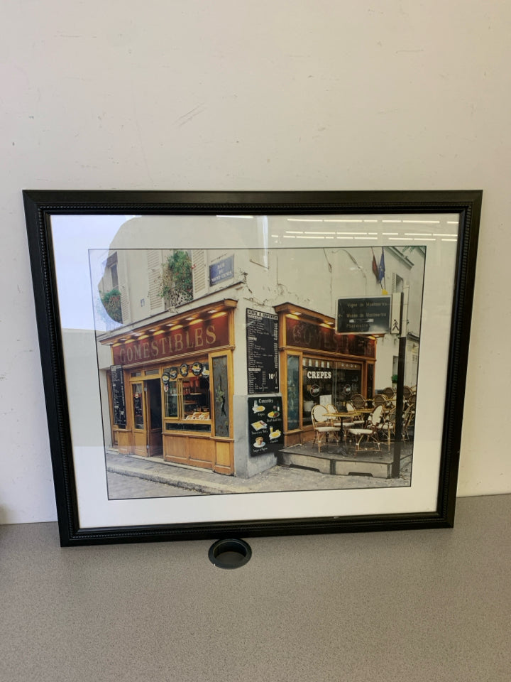 COMESTABLES CAFE FRONT IN BLACK FRAME.