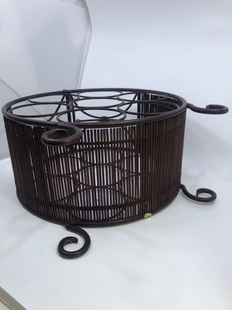 FOOTED BROWN WINE RACK CIRCULAR METAL.