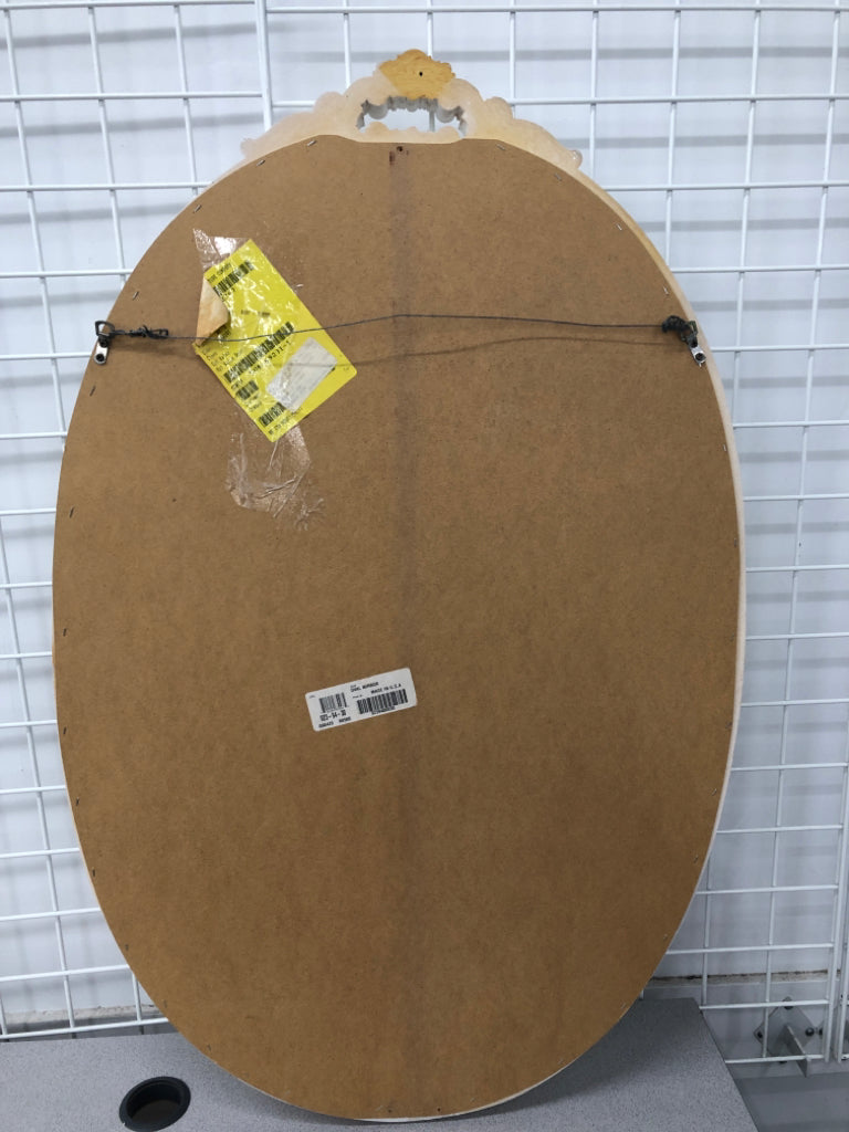 OVAL WHITE MIRROR W/ DECORATIVE TOP.
