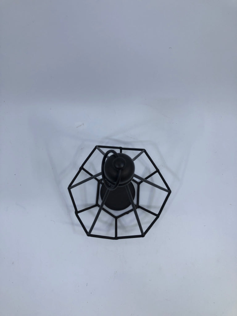 BROWN CAGE PRISM SHAPE TEA LIGHT HOLDER.