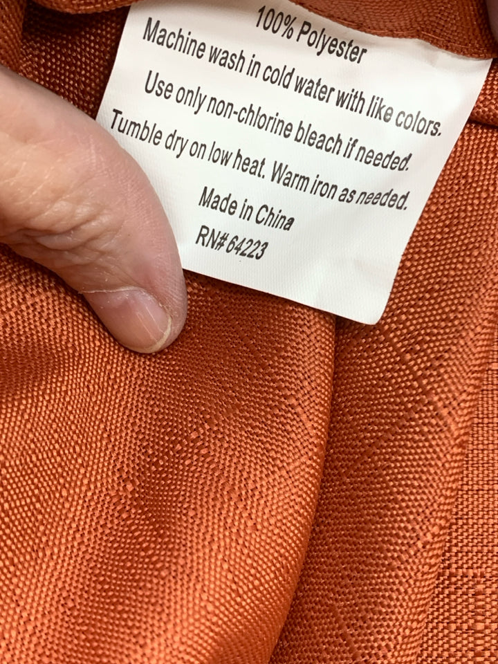 ORANGE TABLECLOTH W/LEAF CUT-OUTS.