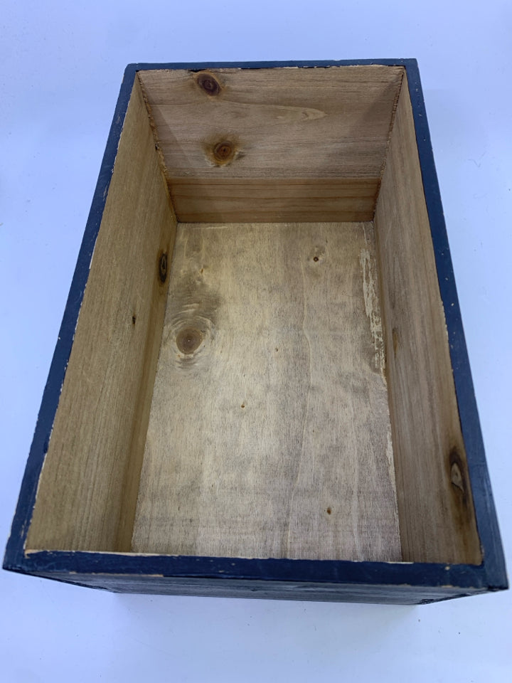 NAVY BLUE WOOD CRATE W WHITE TASSEL TREES.
