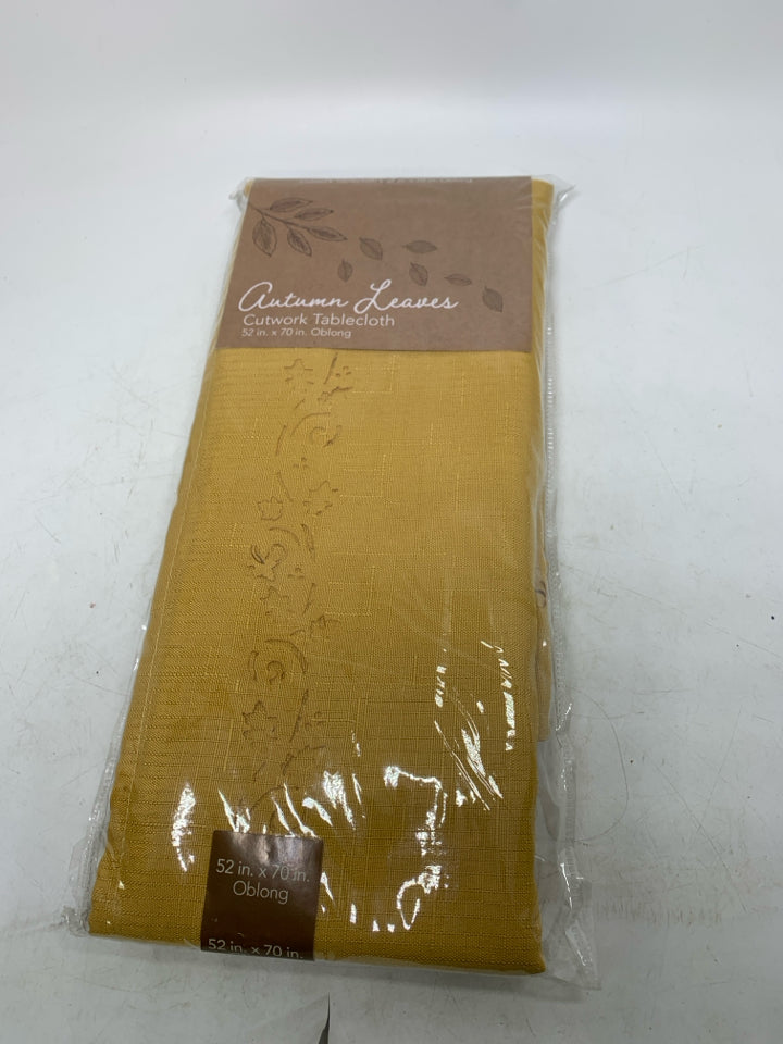 NIP YELLOW CUTWORK TABLECLOTH OBLONG.