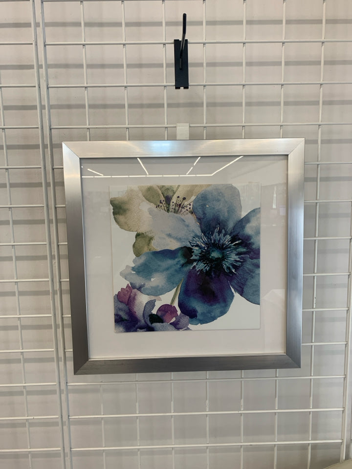BLUE WATERCOLOR FLOWER IN SILVER FRAME.
