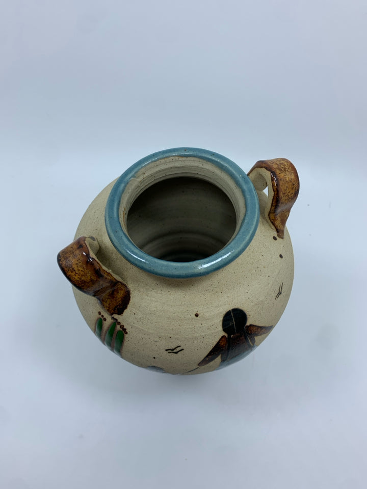 MOTHER AND CHILDREN TEAL GLAZED POTTERY VASE.
