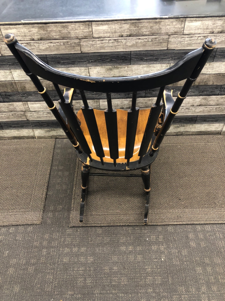 BLACK/BROWN WOOD ROCKING CHAIR W/PAINTED FLOWERS.
