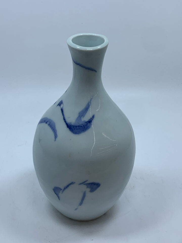 WHITE POTTERY VASE W/BLUE DESIGNS.